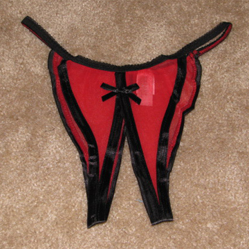 Sheer crotchless panties on the floor.